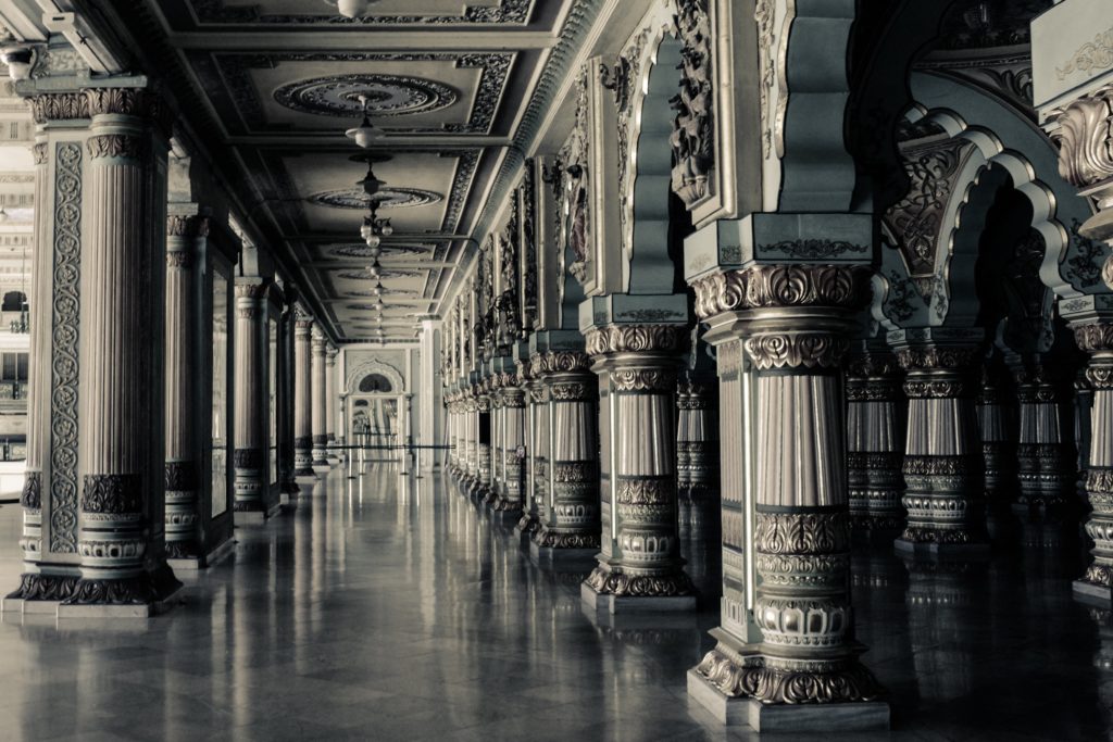 A marble hallway with intricate columns