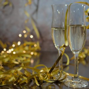 Champagne glasses and golden ribbons